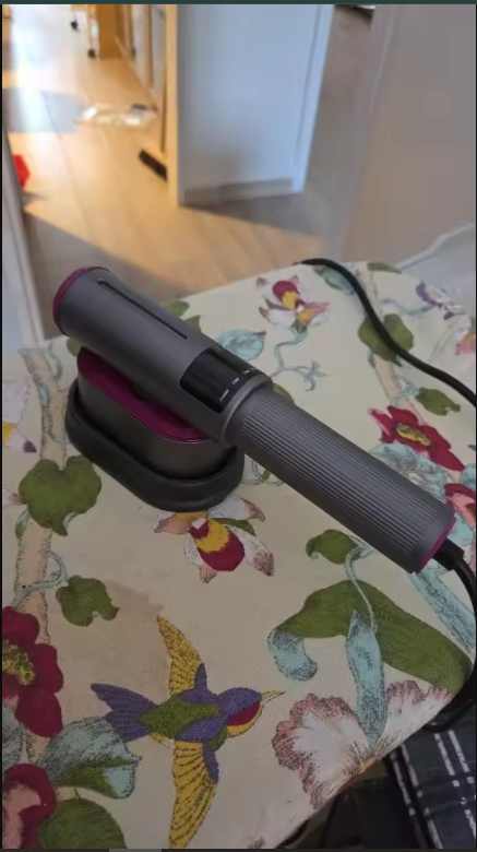 Sophie de Vries using the clothes steamer